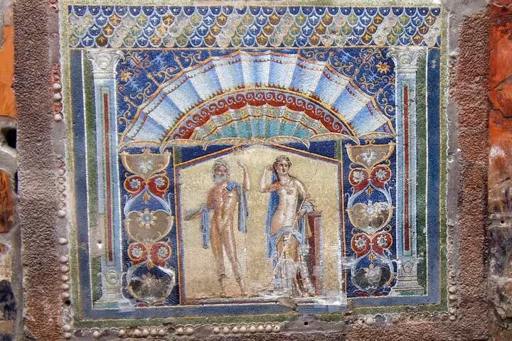 Vibrant ancient mosaic depicting mythological figures in Herculaneum, showcasing intricate Roman artistry and culture.