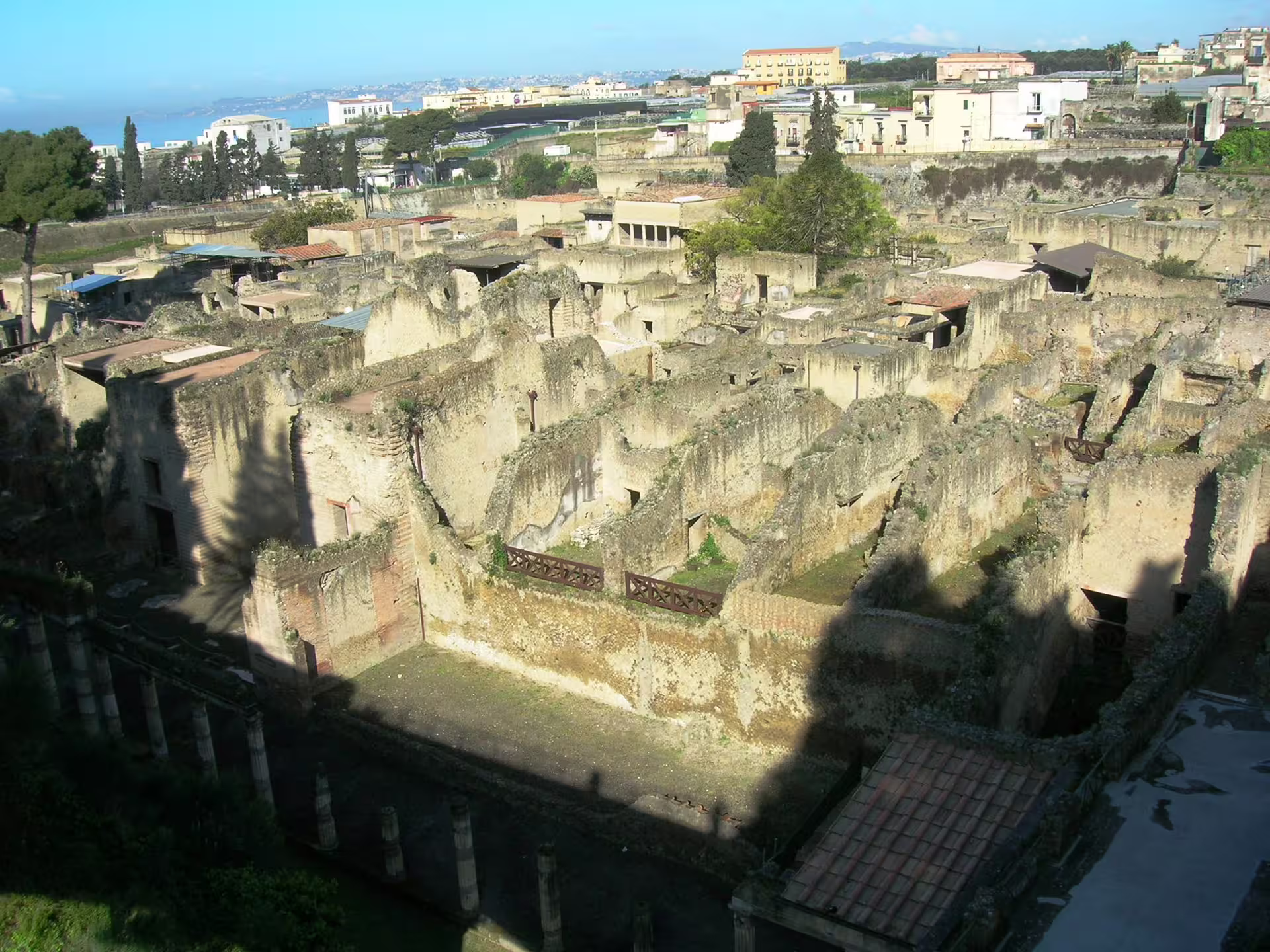 Panoramic view of Herculaneum archaeological site near Naples, showcasing ancient Roman houses and streets on a day tour