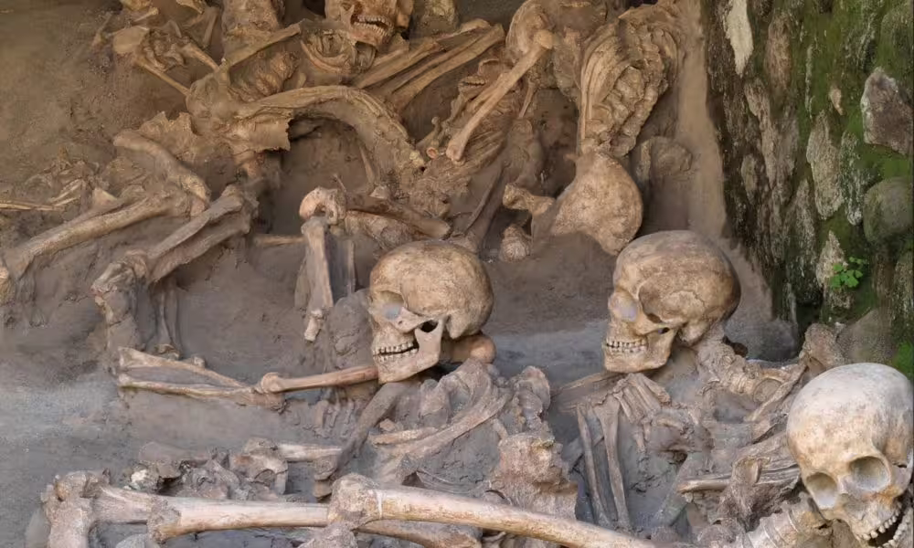 Close-up of Herculaneum boathouse skeletons, dramatic evidence of the Vesuvius eruption seen on guided archaeological tour