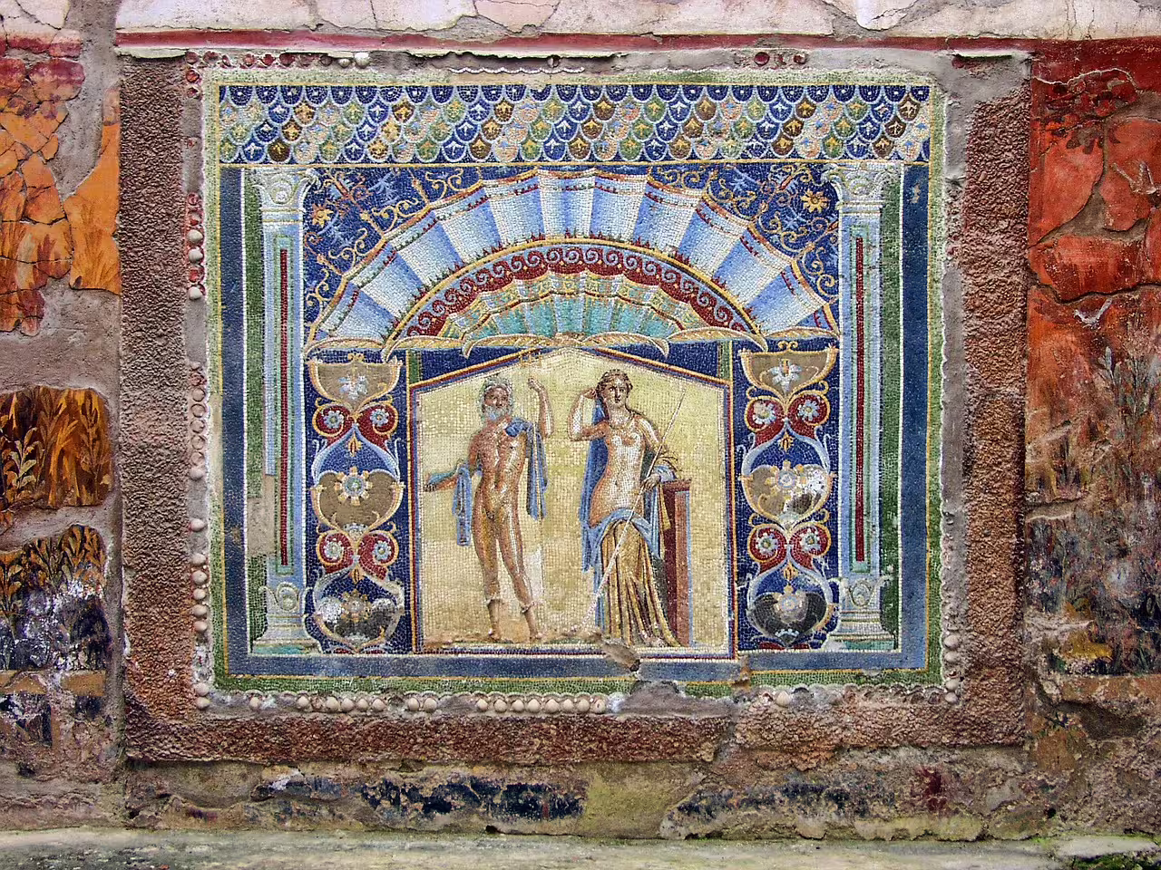 Colorful Roman mosaic in Herculaneum depicting mythological figures, a highlight of guided archaeological tours near Naples