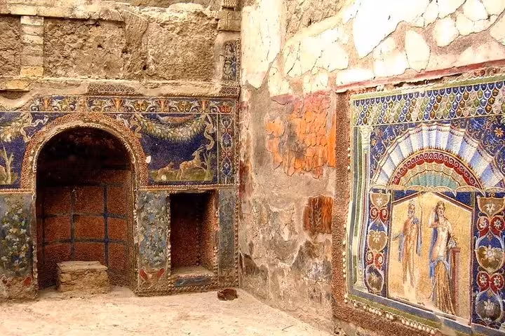 Intricate mosaics and frescoes in Herculaneum showcasing Roman artistry, ideal for history and art lovers.