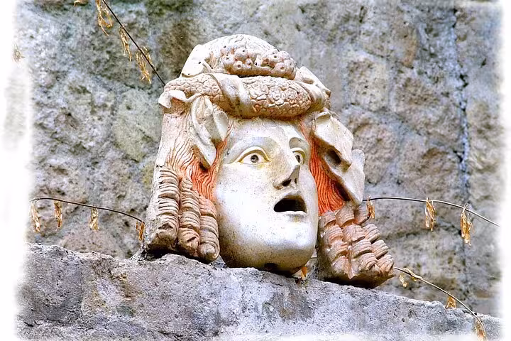 Discover a historic stone mask at Herculaneum, capturing the essence of ancient Roman art and culture.