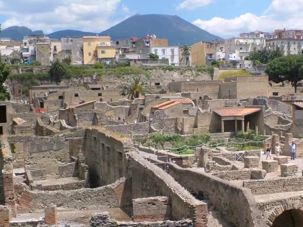 Panoramic view of Herculaneum ruins with Mount Vesuvius and modern Ercolano, part of Pompei Ercolano Mt Vesuvio tour
