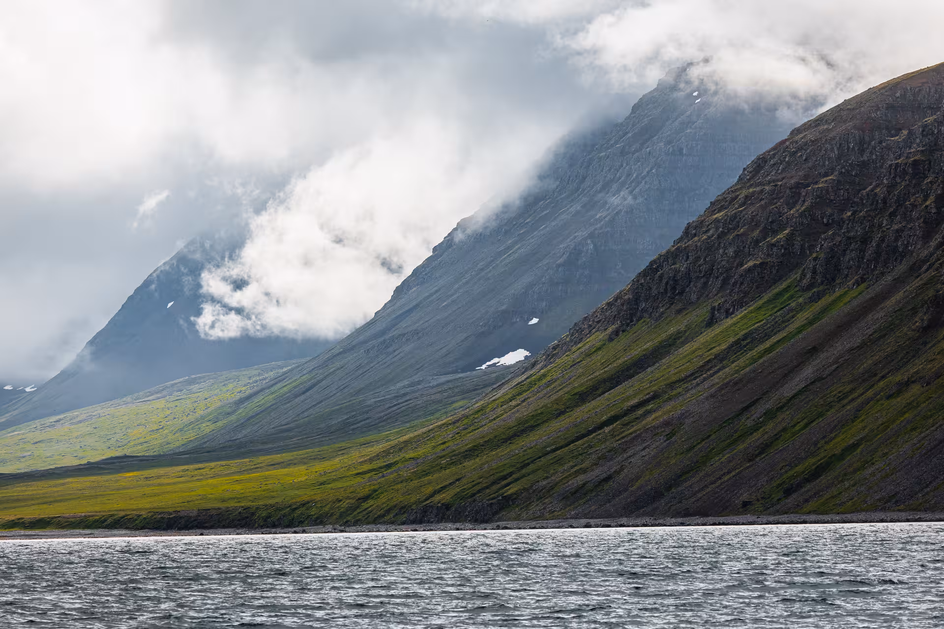 Cloud-wrapped fjord mountains near Hesteyri, Iceland, on the Wildlife & Heritage of Hesteyri tour