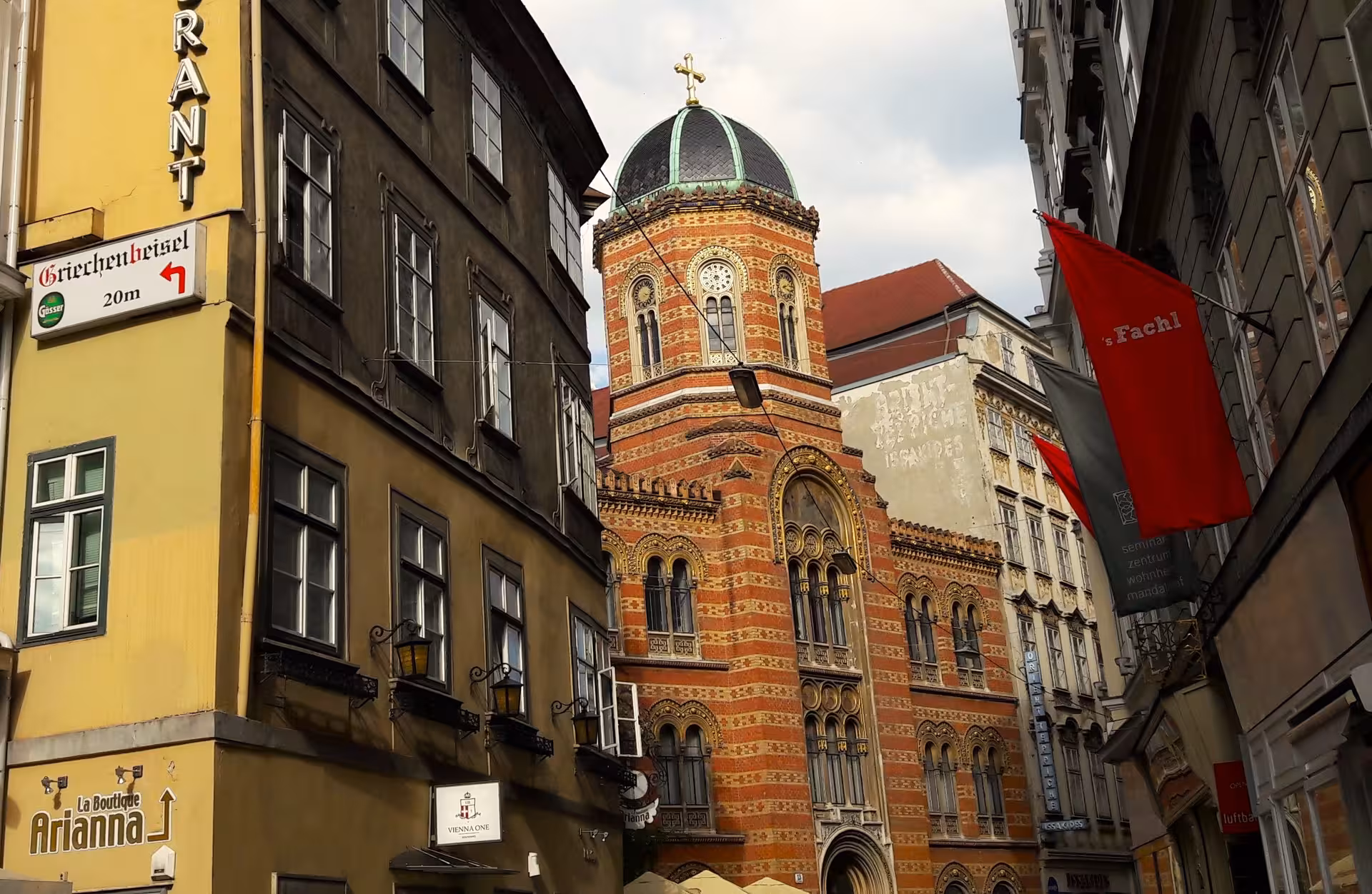 Hidden Vienna walking tour view of Ruprechtskirche dome framed by narrow Old Town street facades