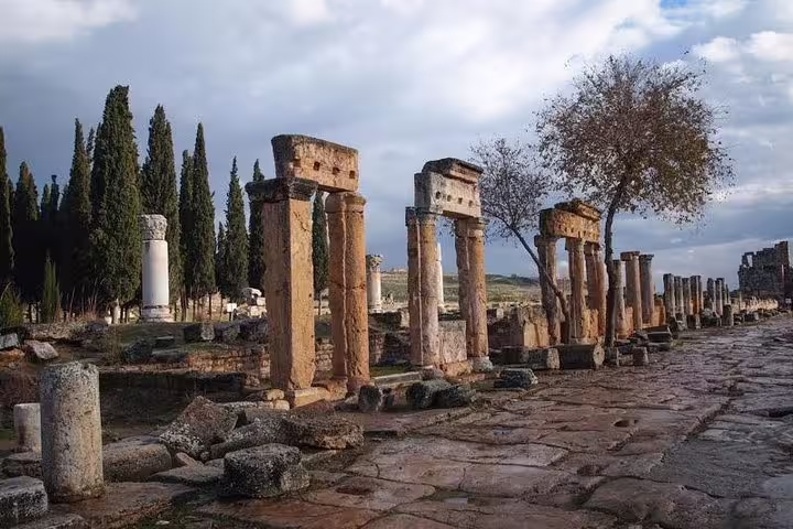 Ancient Roman columns at Hierapolis, Pamukkale, offering historical insights on a day tour from Istanbul with flight.