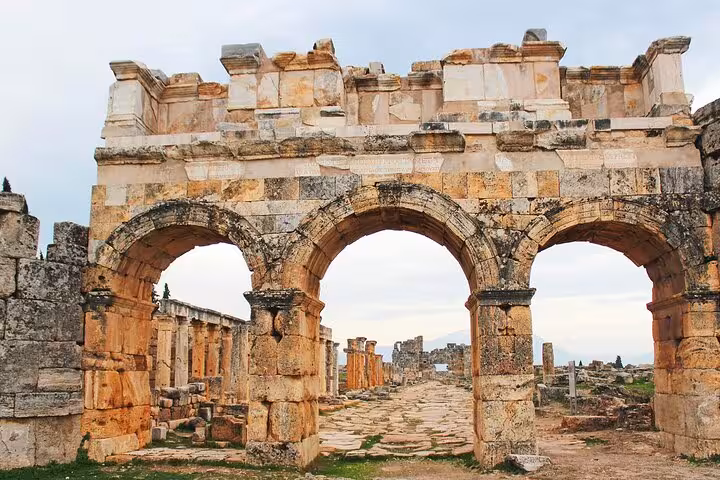 Stone arch gate ruins of Hierapolis Ancient City, visited on private Pamukkale tour from Kusadasi or Selcuk