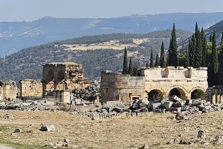 Stone arches and ruins of Hierapolis near Pamukkale, visited on a private Denizli Airport day tour