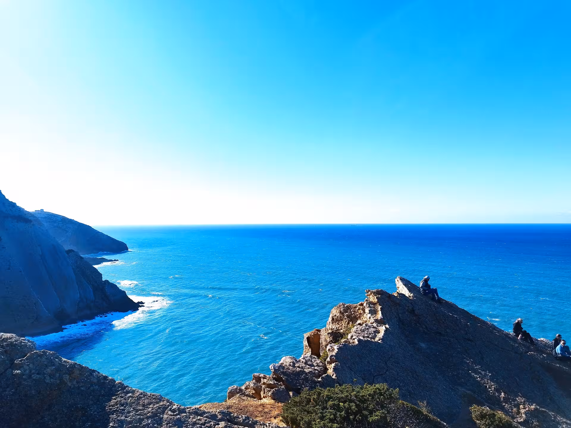 Hikers on Cabo Espichel sea cliffs overlooking the Atlantic, scenic viewpoint on Wild Cabo Espichel tour