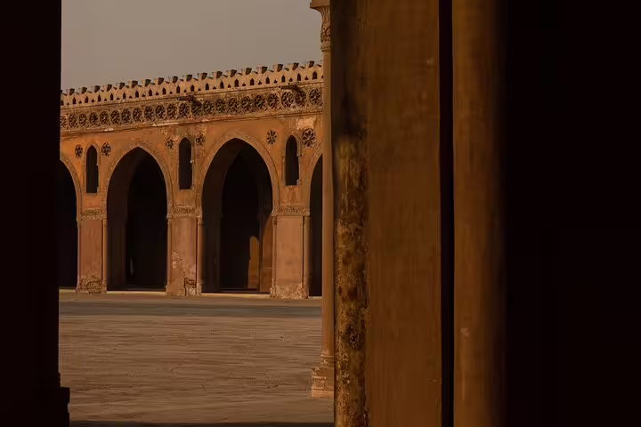 Arched courtyard colonnade in a Historic Cairo mosque, Islamic architecture detail on Cairo mosques tour