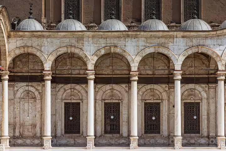 Historic Cairo mosque facade with marble columns and domed roofline, Citadel and Khan el-Khalili tour