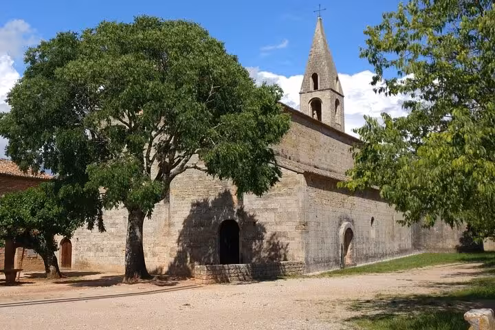 Explore the serene beauty and rustic charm of a historic church nestled in the idyllic French countryside.