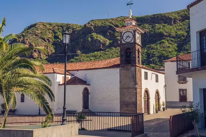 Historic church with clock tower in a quaint village on Tenerife's north coast, ideal for cultural exploration.