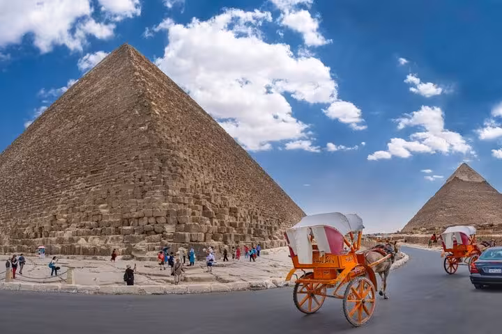 Horse-drawn carriage by the Great Pyramid of Khufu, classic photo stop on VIP Giza highlights tour