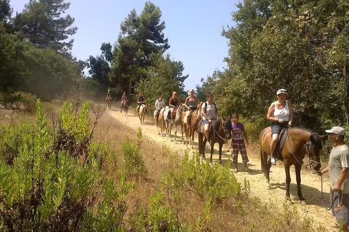 Group of tourists horseback riding through scenic forest trails near Kusadasi Port, perfect for cruise guests.