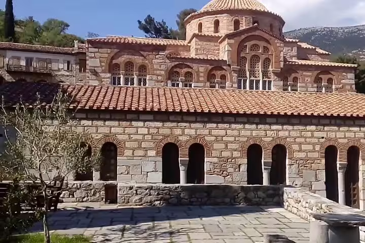 Historic Byzantine architecture at Hosios Loukas Monastery, a highlight on the private day trip from Athens to Delphi tour.