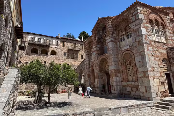 Courtyard and stone façade of Hosios Loukas monastery near Delphi on a full-day private tour to the Oracle site