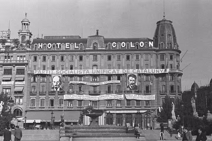 Hotel Colon adorned with socialist banners in Barcelona, symbolizing political movements during the Spanish Civil War.