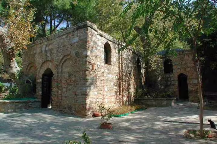 Explore the historic House of the Virgin Mary surrounded by lush greenery on an Ephesus day tour from Istanbul.
