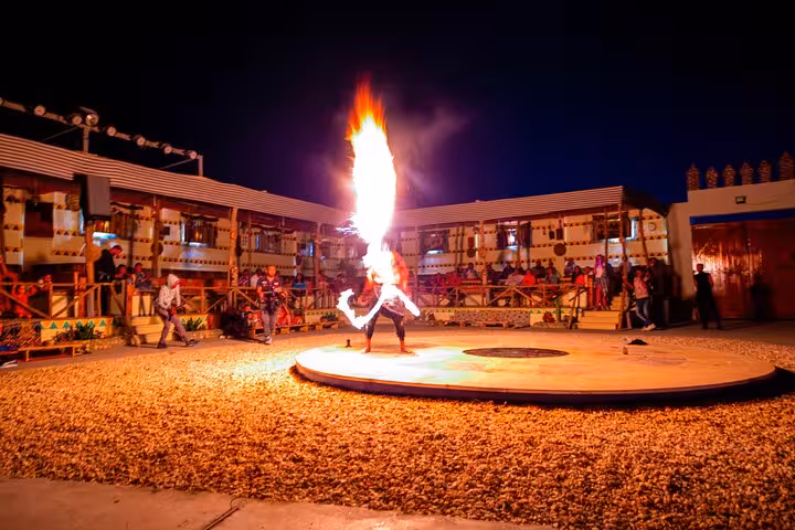 Fire show at Bedouin camp dinner on HRG family safari with quad and Jeep desert adventure in Hurghada