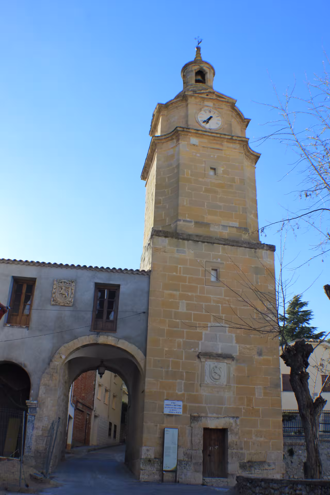 Clock tower and arched gate in Huete old town, Cuenca, on the Guided tour of Huete Monumental