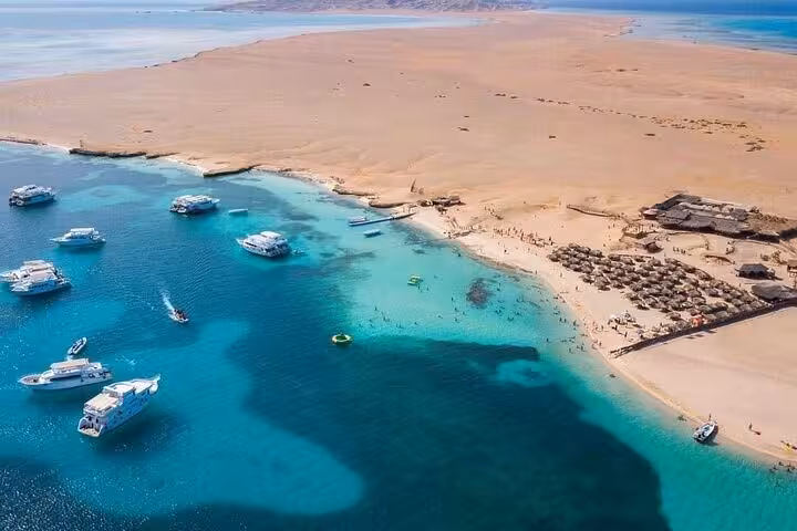 Aerial view of Hula Hula Island sandbar and boats in crystal Red Sea, Hurghada sea trip with water sports