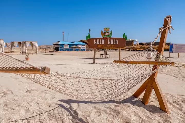 Beach hammock on Hula Hula Island, relaxing stop on Hurghada private speedboat tour with snorkeling in Red Sea