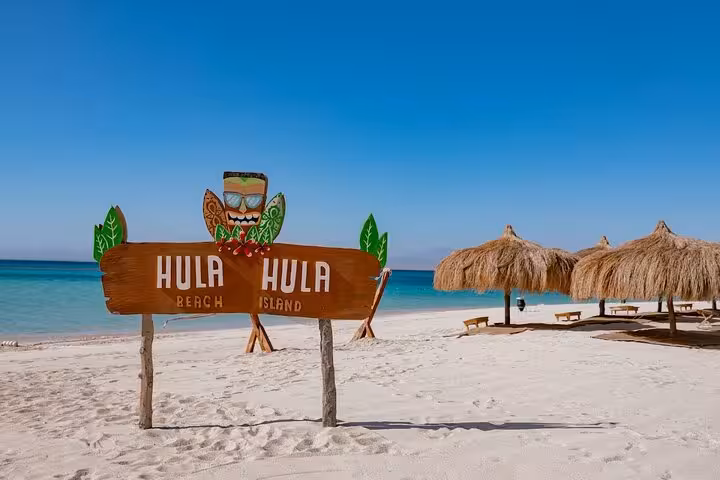 Hula Hula Island beach sign on white sand in the Red Sea, stop on private speedboat tour from Hurghada