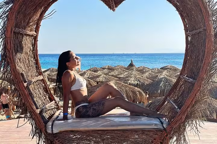 Relaxing at Hula Hula Island Hurghada in a heart-shaped cabana with Red Sea views on a snorkeling day trip