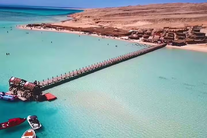Aerial view of Hula Hula Island pier and turquoise lagoon on VIP boat snorkeling trip from Hurghada