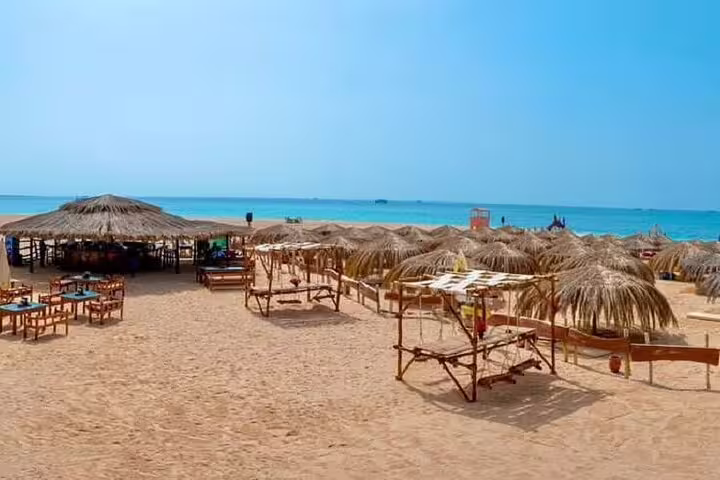 Hula Hula Island Hurghada beach huts and sunbeds on the Red Sea, stop on VIP boat snorkeling day tour