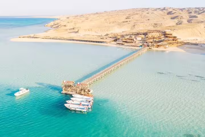 Aerial view of Hula Hula Island pier and boats in turquoise Red Sea, VIP snorkeling excursion from Hurghada