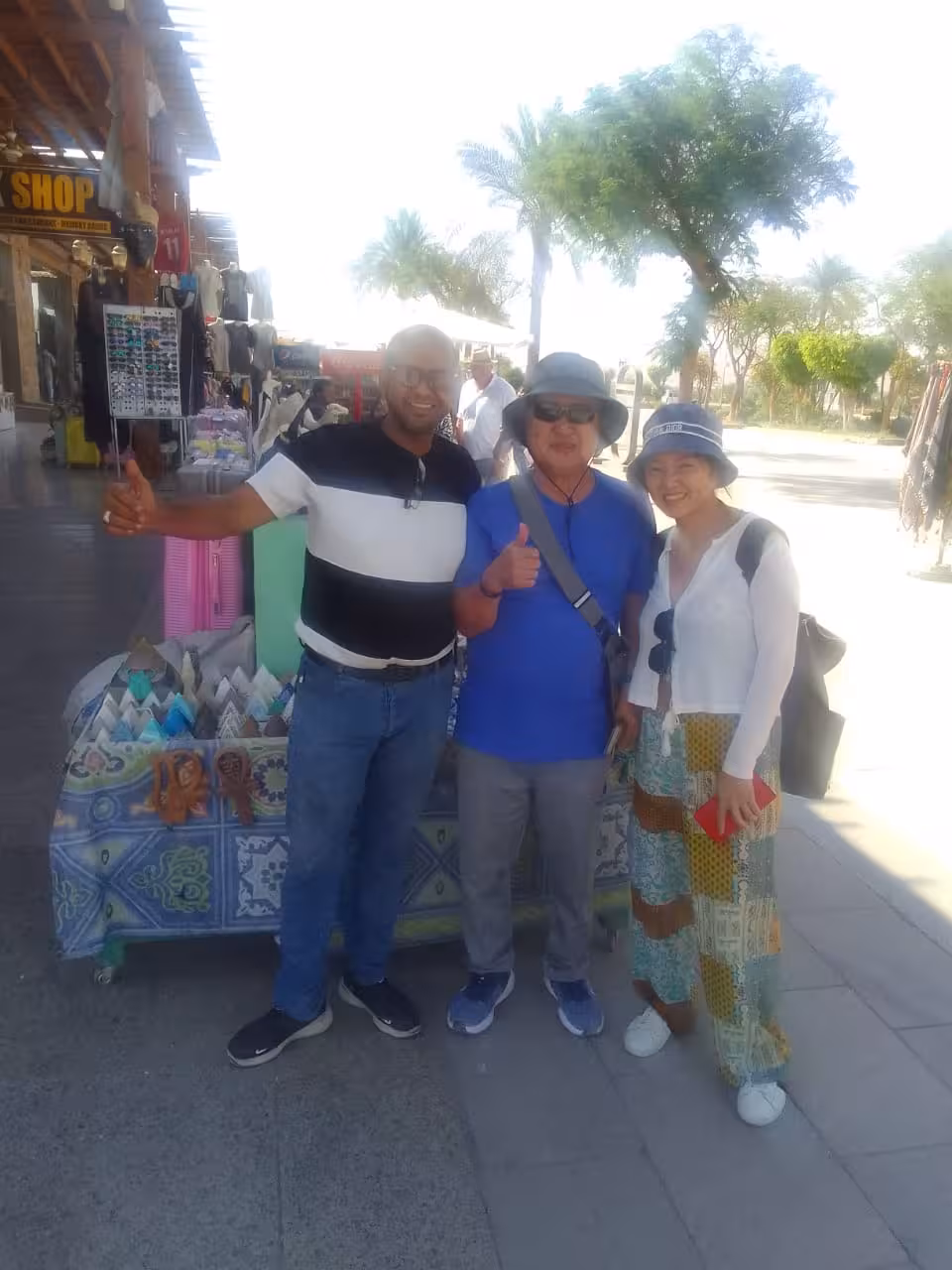 Tourists with local guide in Hurghada market, meeting point for reliable airport transfer and hotel pickup service