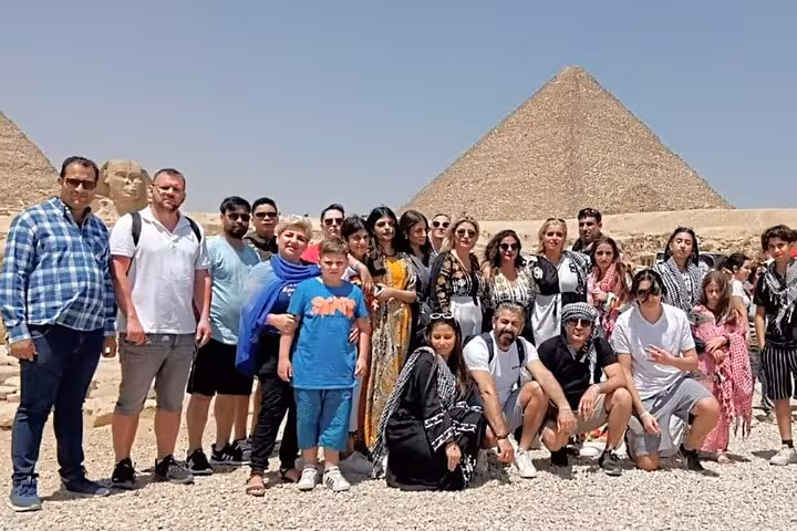 Travelers at the Great Pyramid of Giza on Hurghada to Cairo full-day tour with Egyptian Museum visit