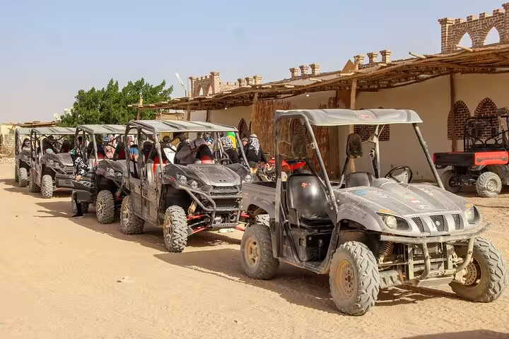 Lined up off-road buggies at Hurghada desert camp ready for adrenaline safari ride with ATV, dinner and show