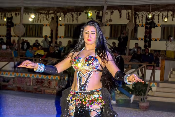 Belly dancer performs at Hurghada desert camp dinner show after ATV quad bike and buggy safari adventure
