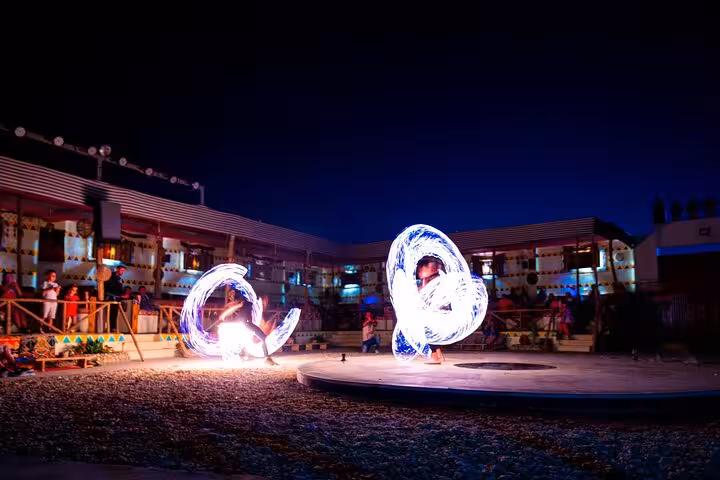 LED fire dance show at Hurghada desert camp dinner, part of ATV quad bike and buggy safari tour