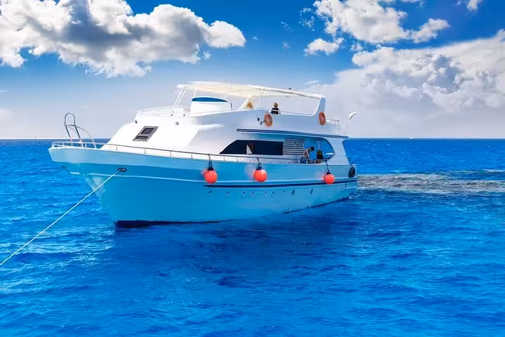 White tour boat on the Red Sea for Hurghada Dolphin House snorkeling cruise, full-day trip with lunch onboard