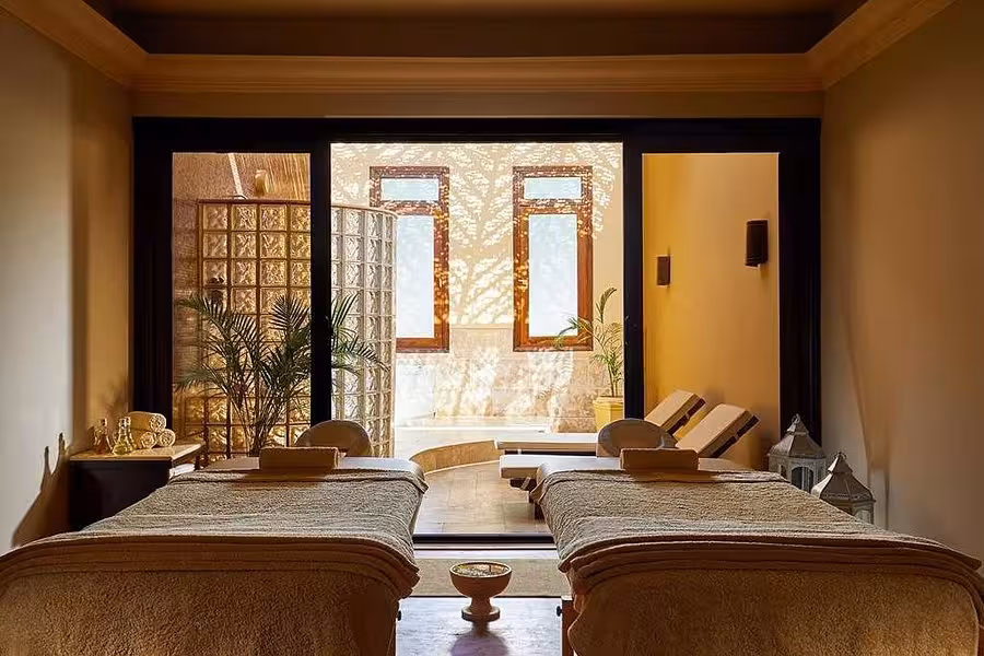 Luxurious spa room in Hurghada Egypt featuring massage tables and serene natural light for ultimate relaxation.