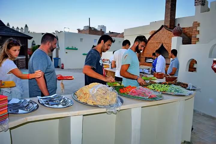 Buffet dinner at Bedouin village with fresh salads and grilled food on Hurghada Jeep Super Safari desert tour
