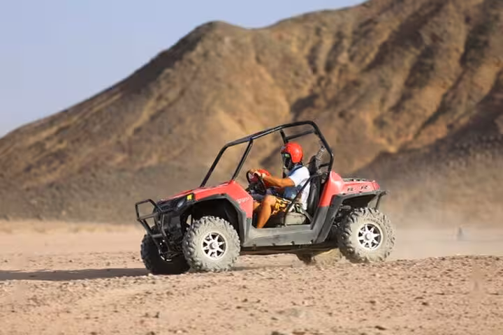 Off-road buggy racing in Hurghada desert mountains during jeep super safari to Bedouin village adventure