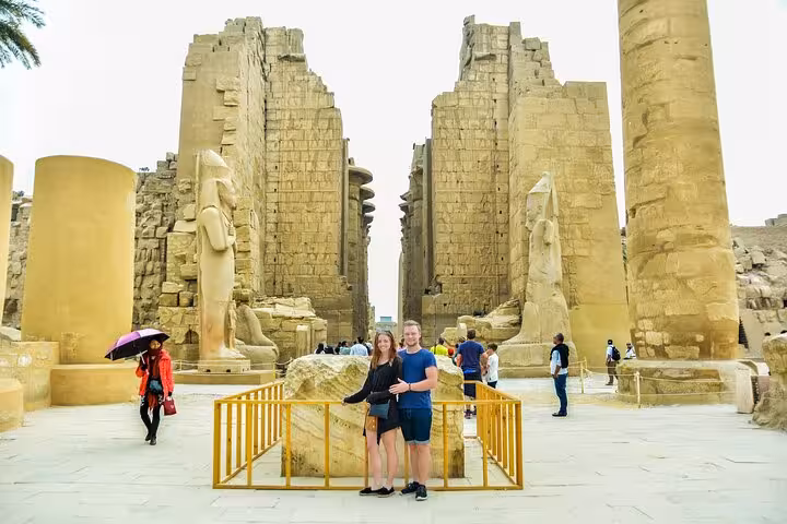 Couple at Karnak Temple entrance on Hurghada to Luxor day trip, visiting Valley of the Kings and Tutankhamun tomb