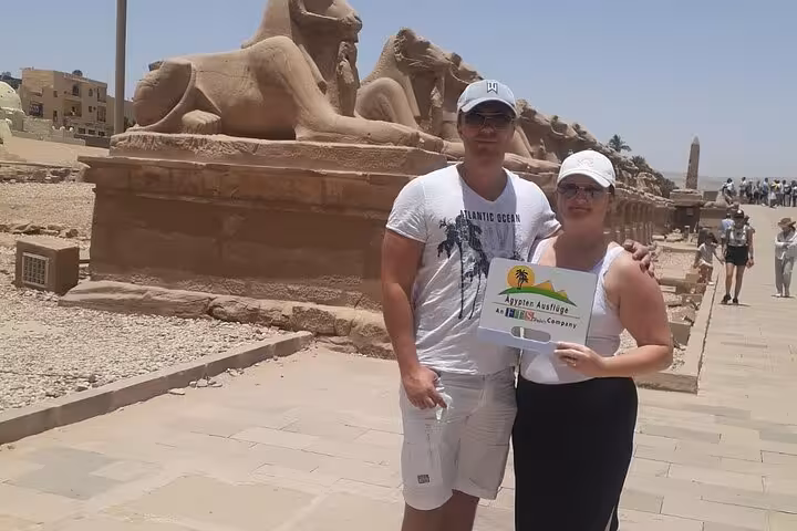Travelers at Karnak Temple sphinx avenue on Hurghada to Luxor tour, Valley of the Kings day trip