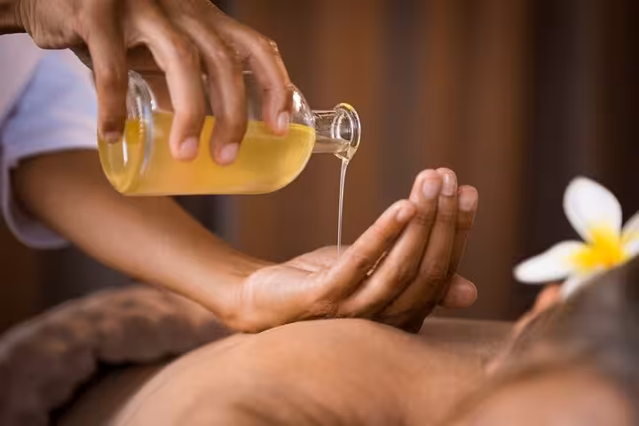 Massage oil poured for Hurghada full-body spa treatment with jacuzzi, steam room and sauna experience