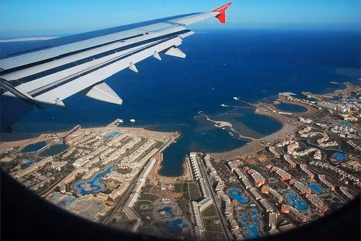 Aerial view of Hurghada Red Sea coastline from airplane window, perfect start to a Hurghada city tour in Egypt