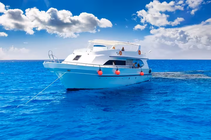 Hurghada Red Sea dive boat on clear blue water for beginner and certified scuba diving day trip and snorkeling