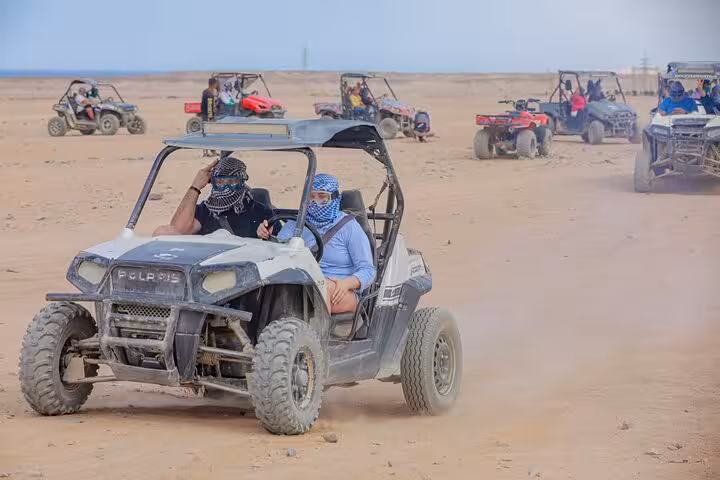 Spider car buggy driving in Hurghada desert safari with quad bikes convoy, plus dinner show and free shopping