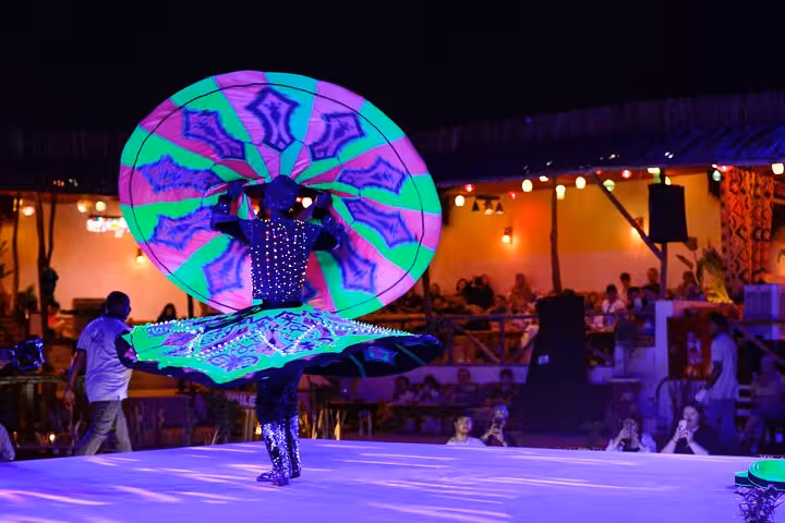 Tanoura dancer performing at Hurghada desert dinner show on Super Quad and Spider car safari night