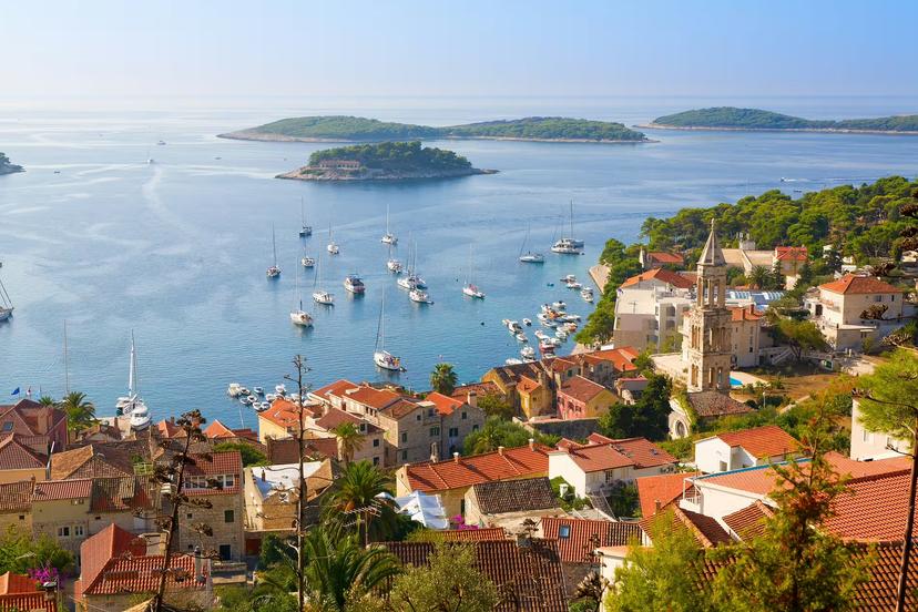 Hvar Town harbor view with sailboats and Adriatic islands, a scenic stop on a UNESCO self-drive tour