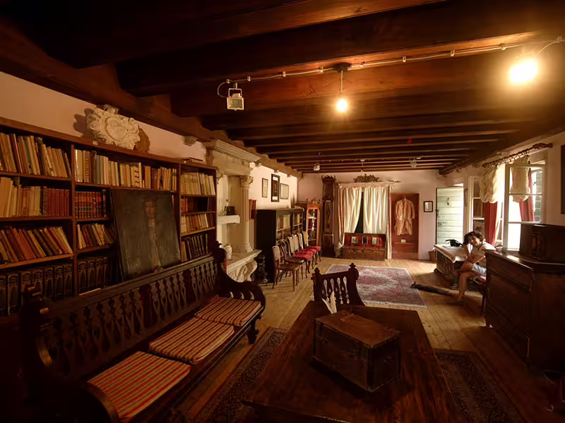Historic Hvar Island museum interior with wooden beams and library, stop on private boat tour Croatia